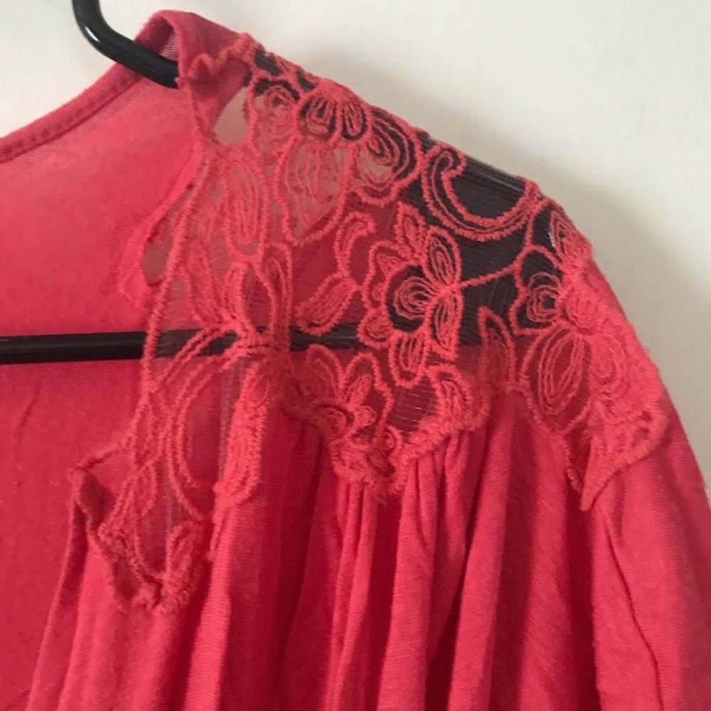 Salmon colored blouse with lacy shoulders